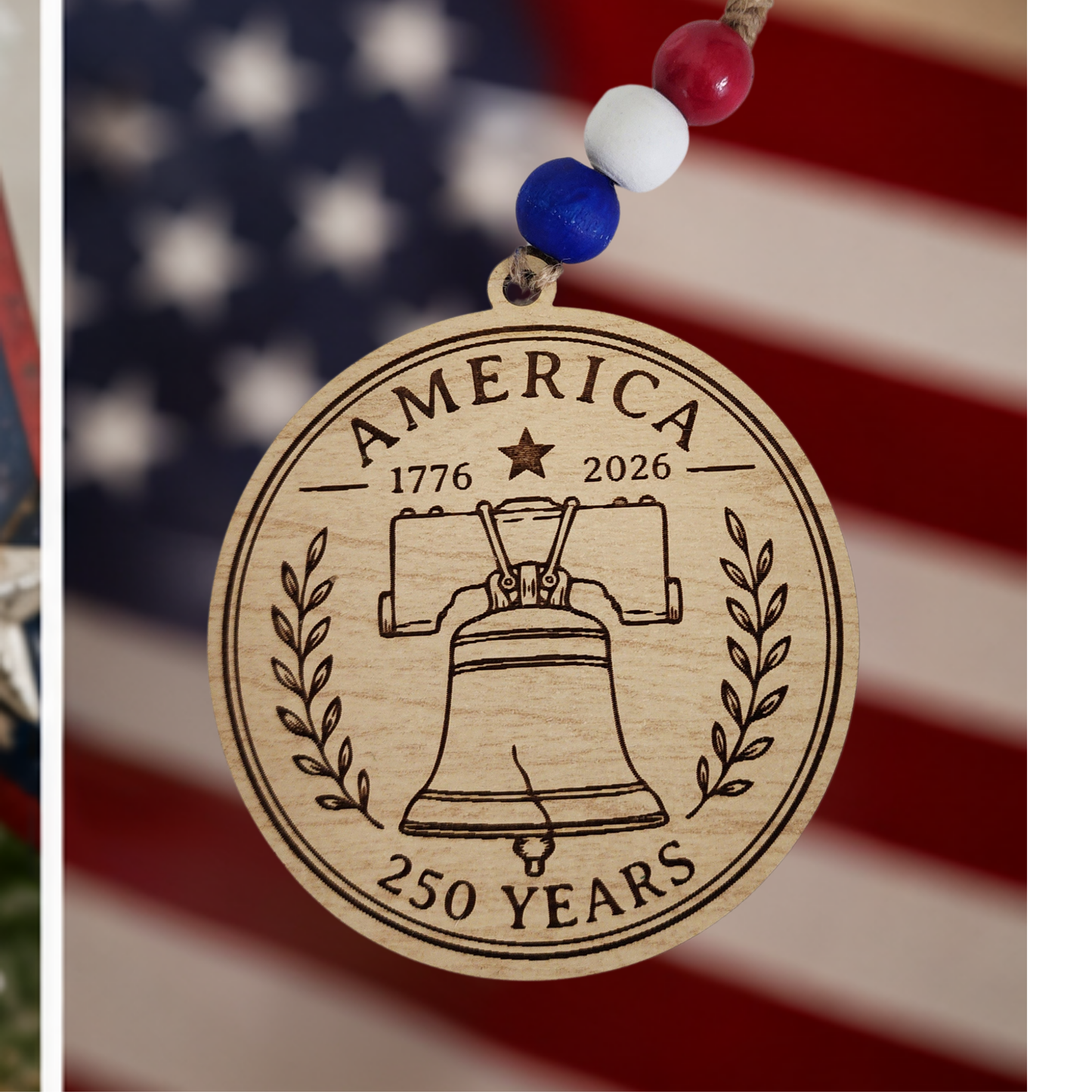 Handcrafted wooden America 250 ornament featuring Liberty Bell. Laser engraved patriotic keepsake with red, white, and blue bead accents celebrating America's 250th anniversary.