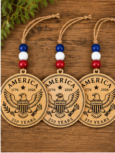 Handcrafted wooden America 250 ornament featuring Eagle. Laser engraved patriotic keepsake with red, white, and blue bead accents celebrating America's 250th anniversary.